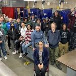 A group photo of students in a shop class.