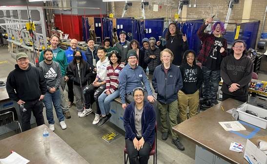 A group photo of students in a shop class.